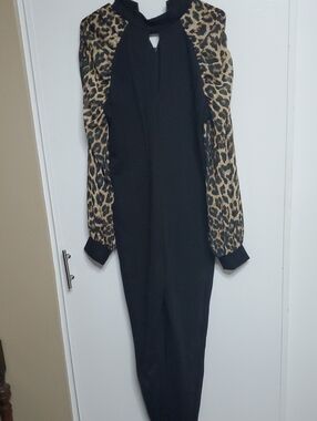 bebe Black Knit Jump Suit with Animal Print Sleeves. Stretch.